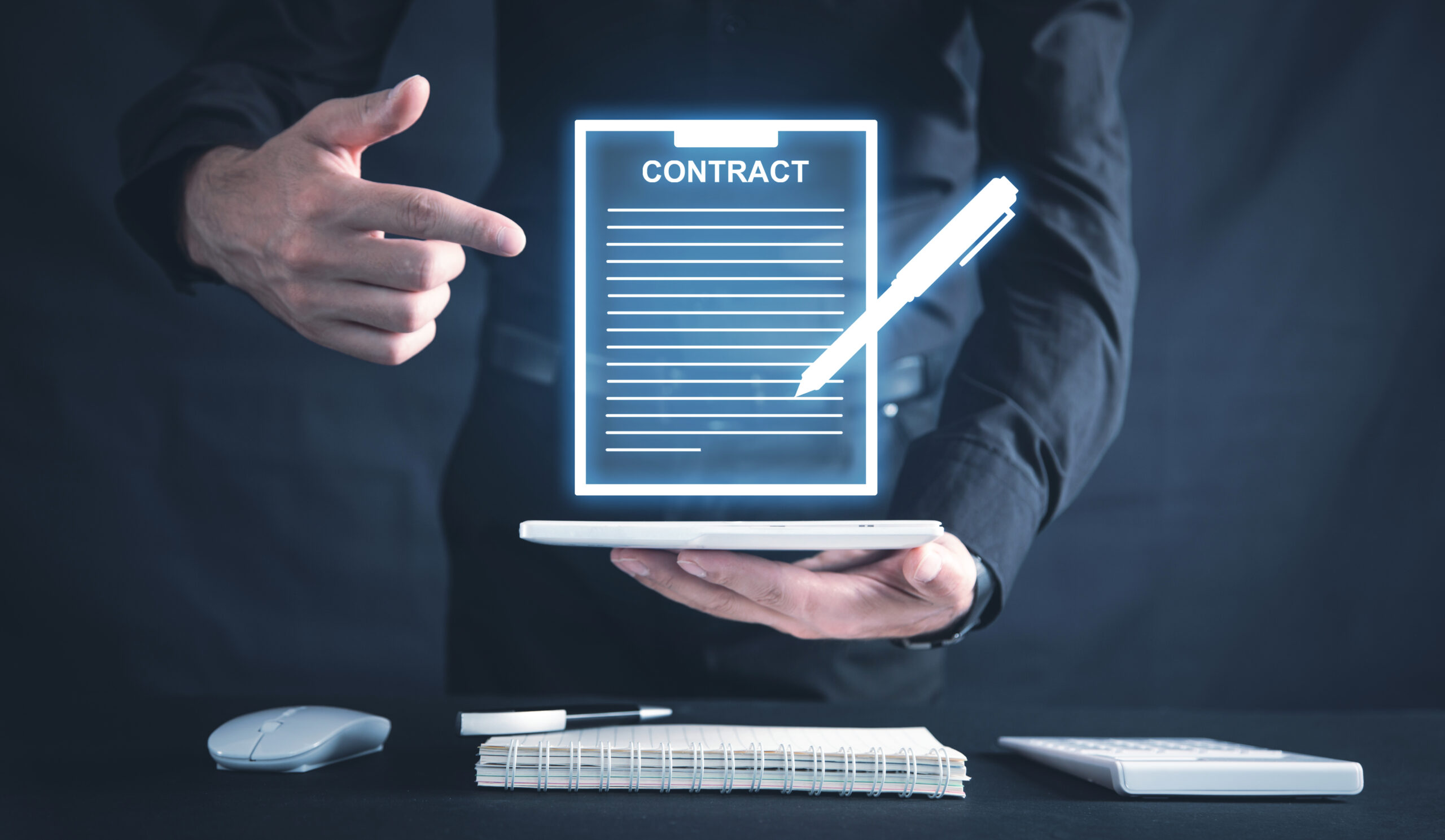 Person presenting a digital contract above a tablet, highlighting eSignature for sales contracts and efficient online signing.