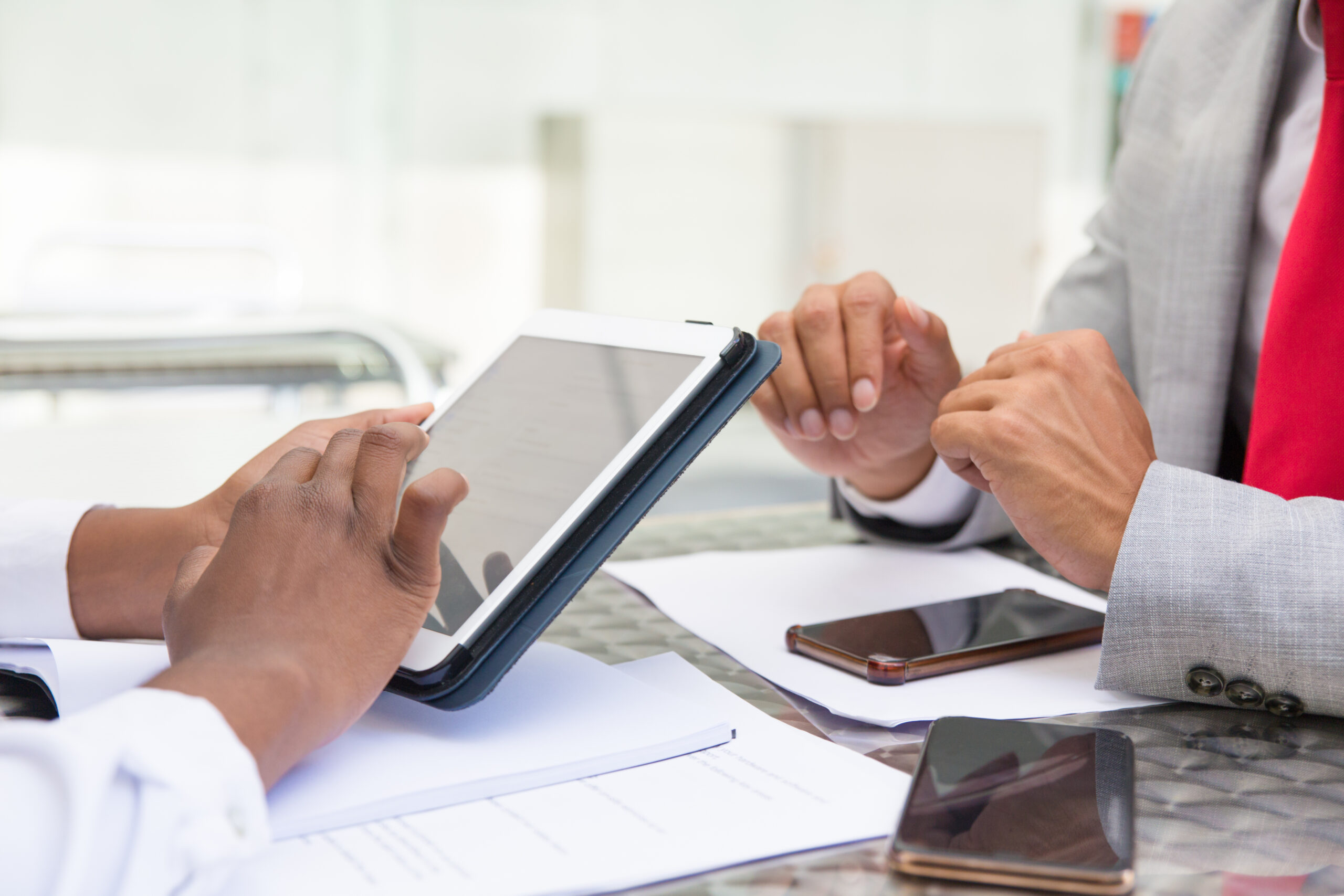 Esignatures used on a tablet to securely sign financial documents, demonstrating a modern eSignature for finance workflow.
