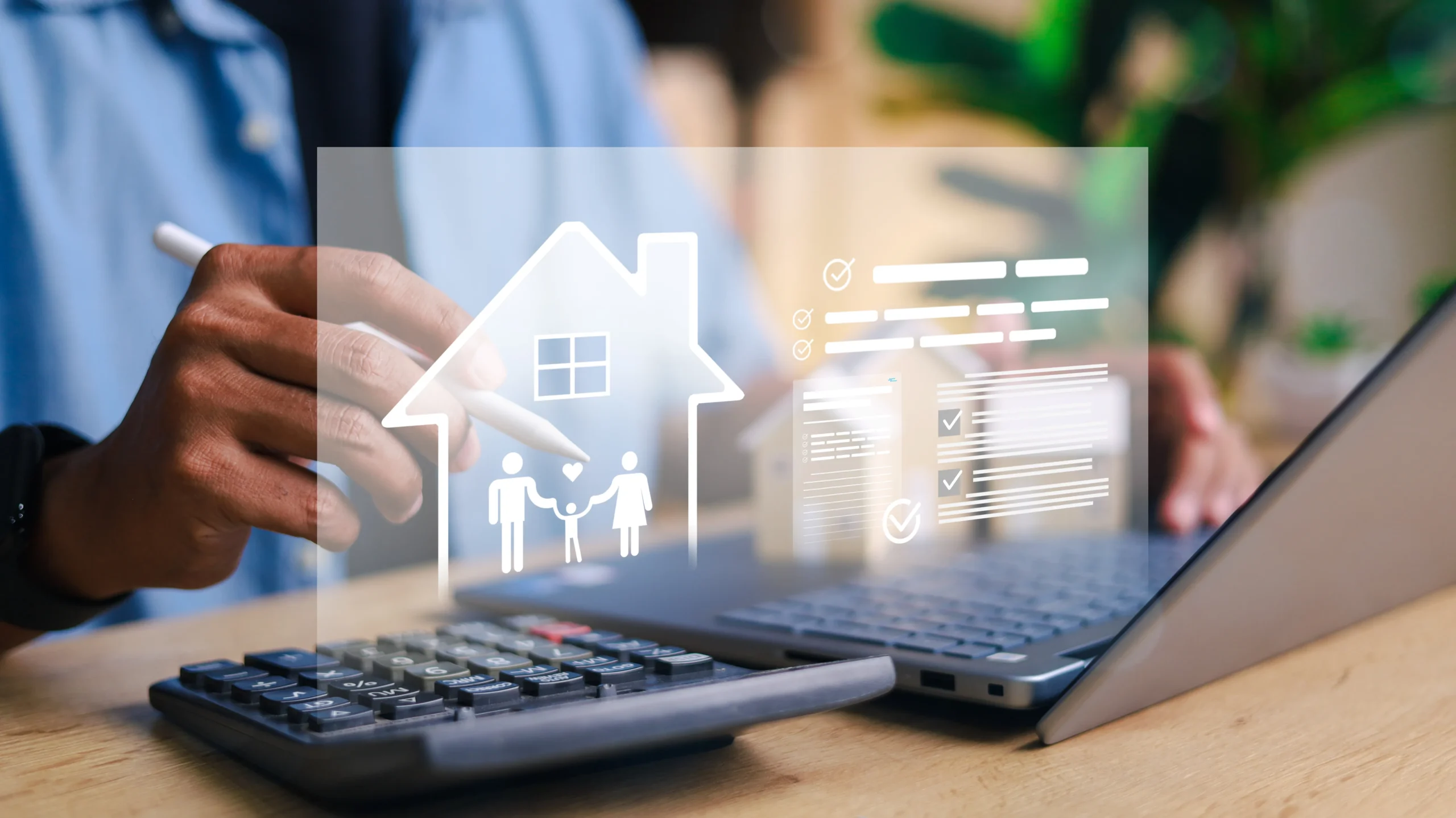 Person working at laptop with calculator, viewing digital overlay showing house icon with family silhouettes and insurance policy documents with checkmarks, representing home and family insurance planning