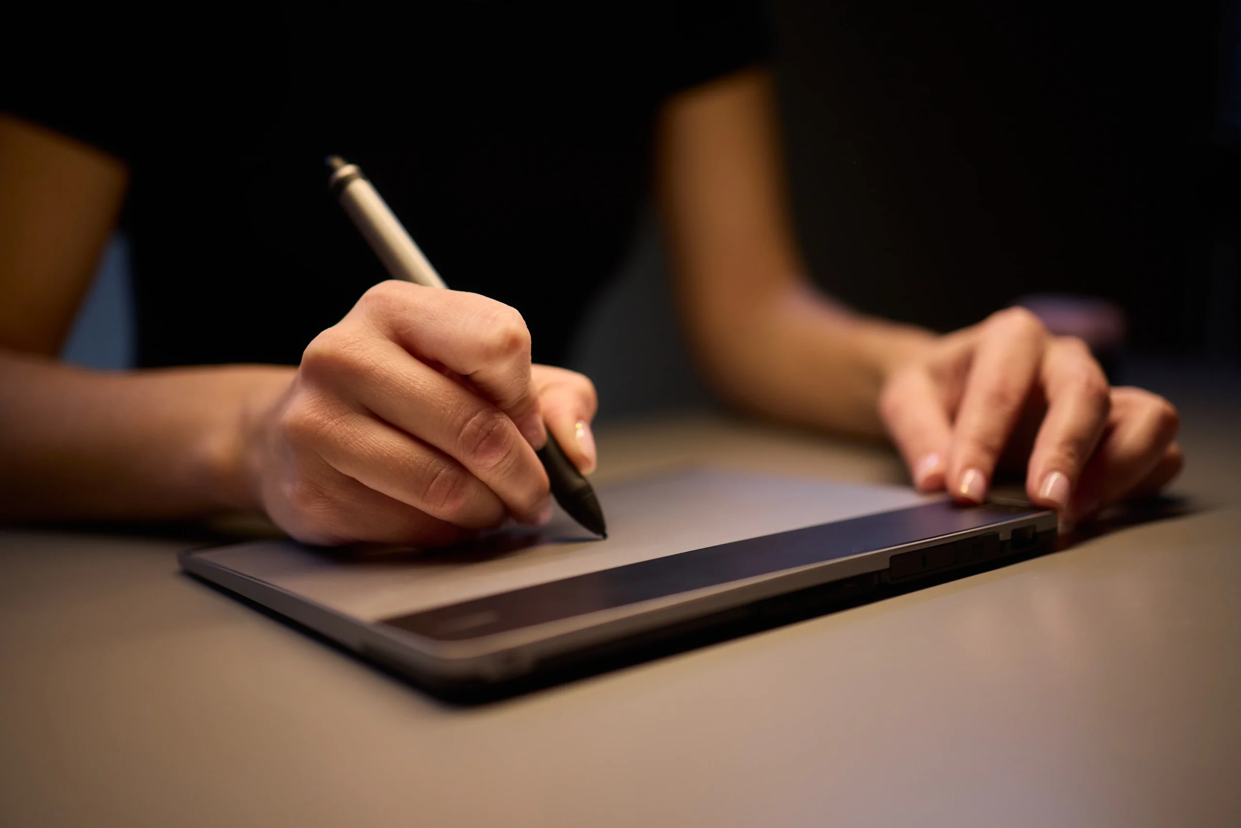 Business professional using an eSignature app for sales contracts on a digital tablet for fast and secure online contract signing.
