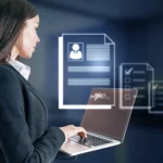 Professional woman in business attire using laptop with digital document management interface showing profile, signature field, and checklist icons floating above screen.