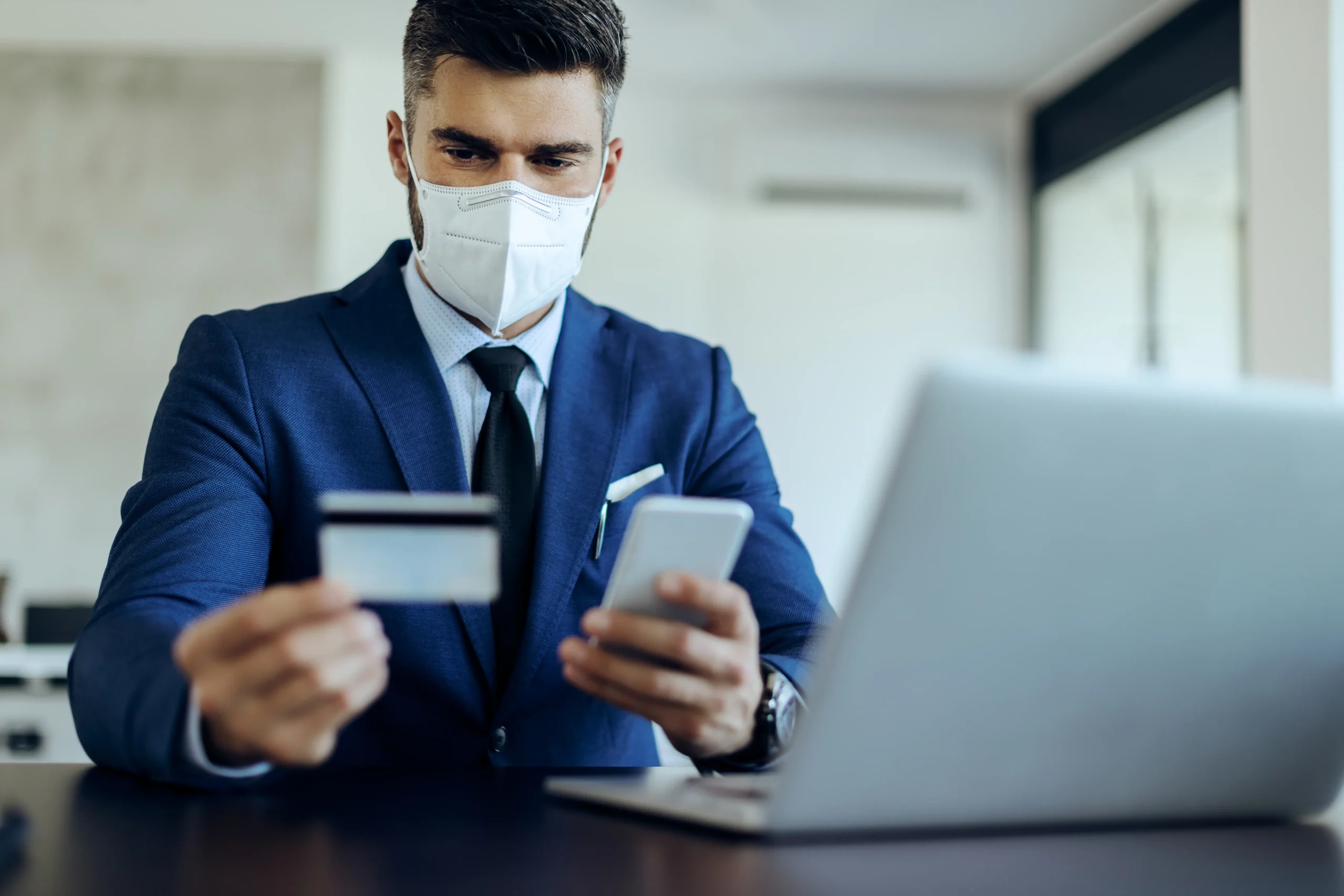 Business professional verifying online transactions with Financial eSignatures and eSignature for financial agreements on secure devices.