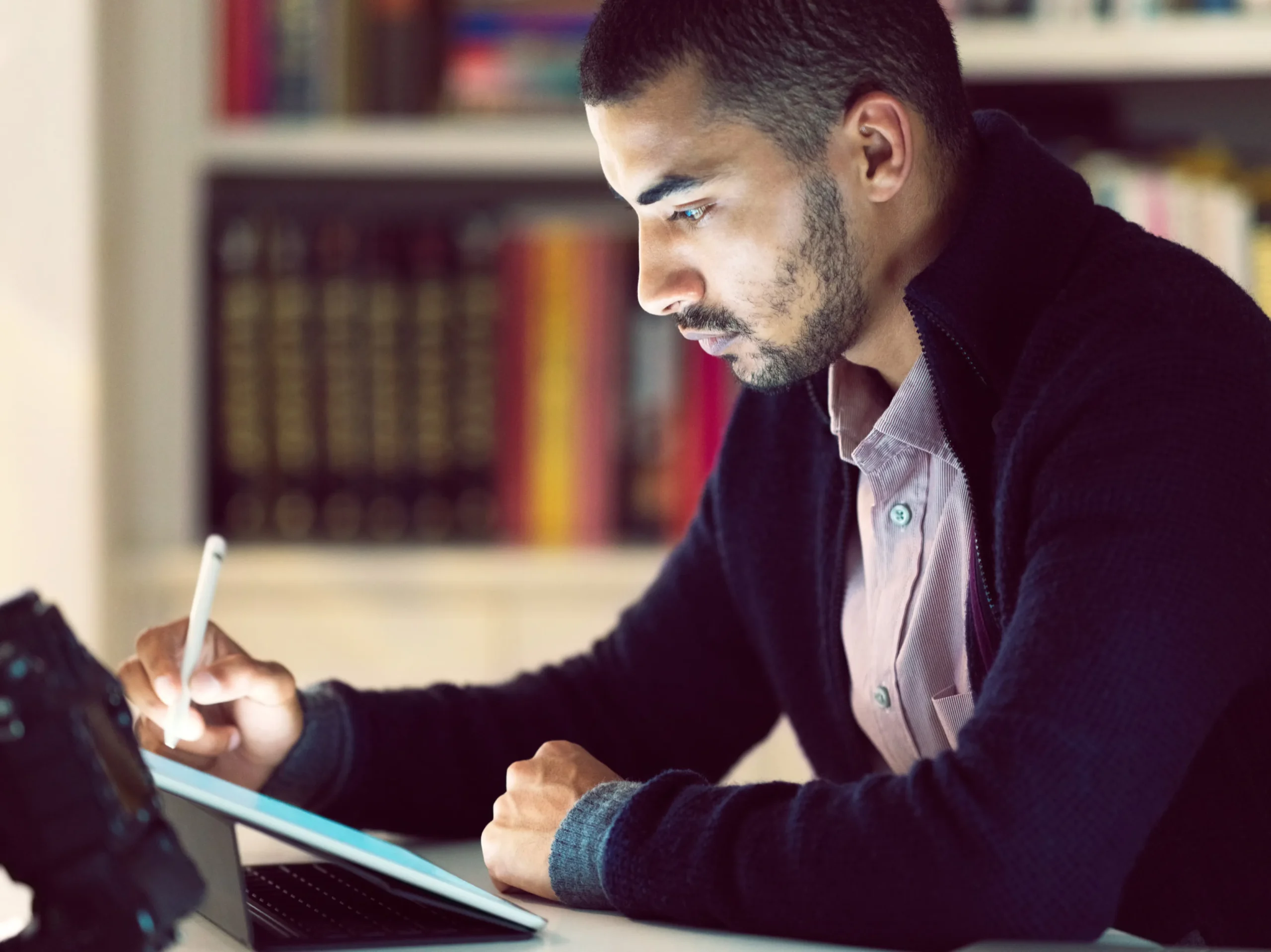 User signing documents digitally on a tablet with a stylus, showcasing a modern e-signature solution for fast and paperless workflows.