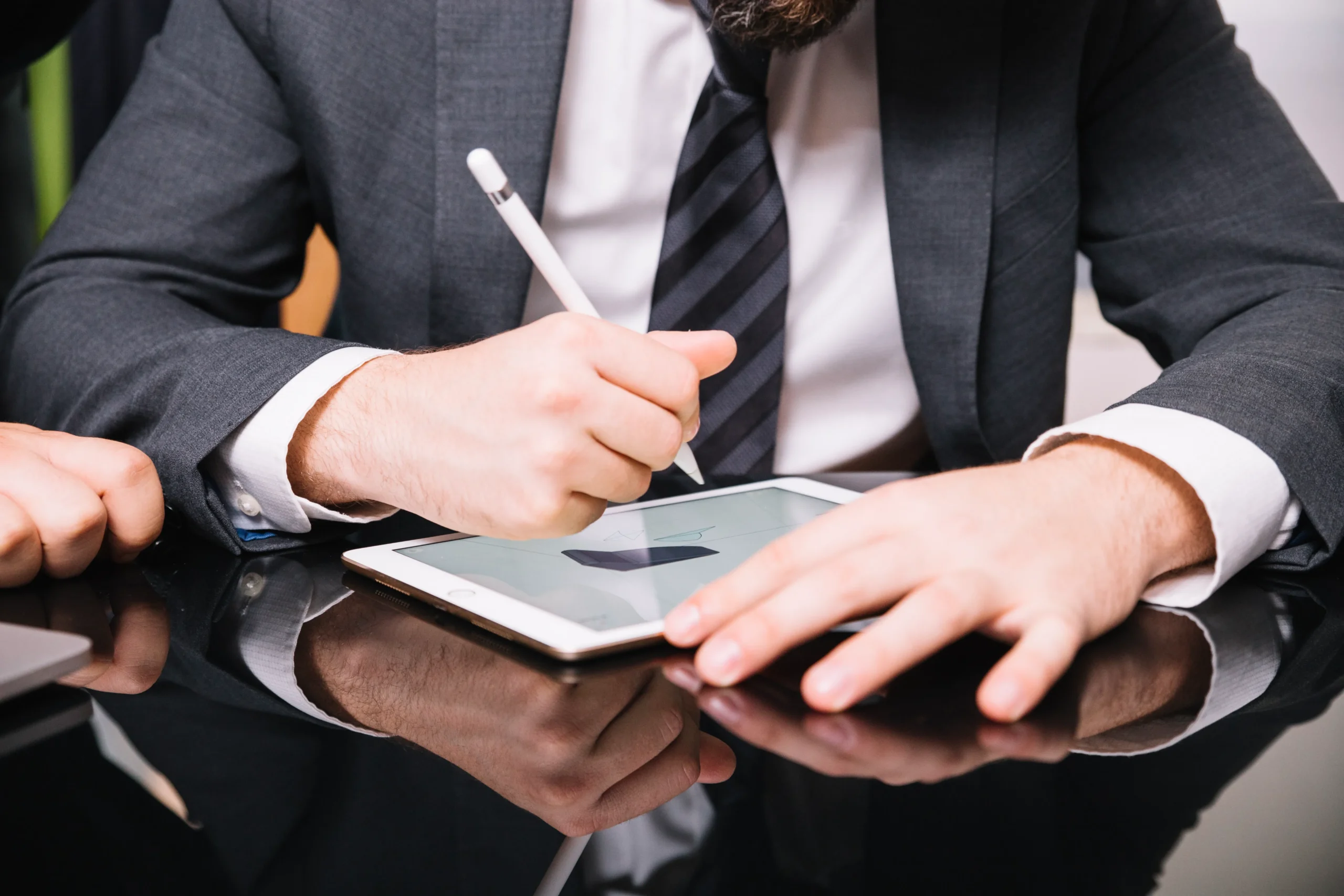 Business professional signing a digital contract on a tablet using an e-signature — showcasing modern electronic signing with SignBulb eSignature App.