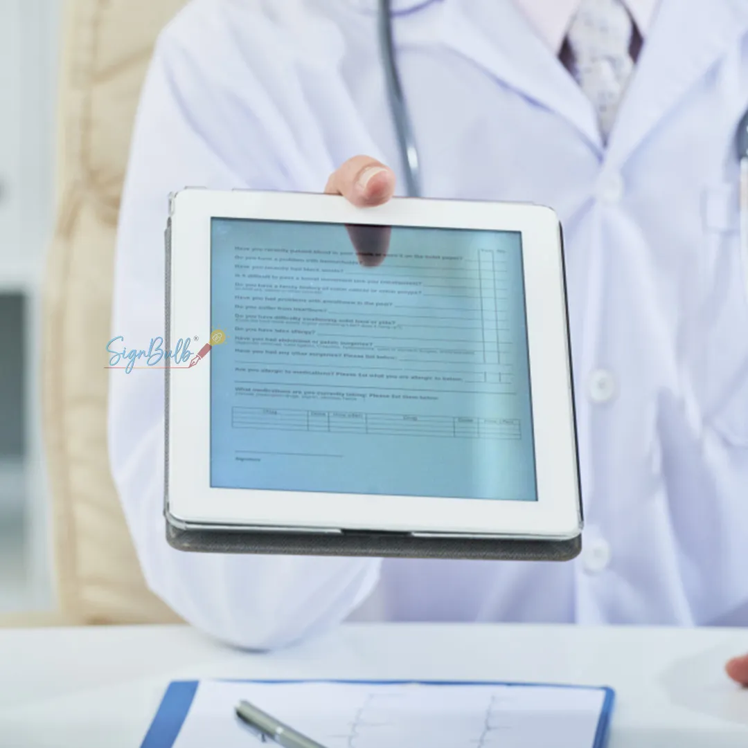 Doctor presenting a digital consent form signed using an Electronic Signature for Healthcare solution.