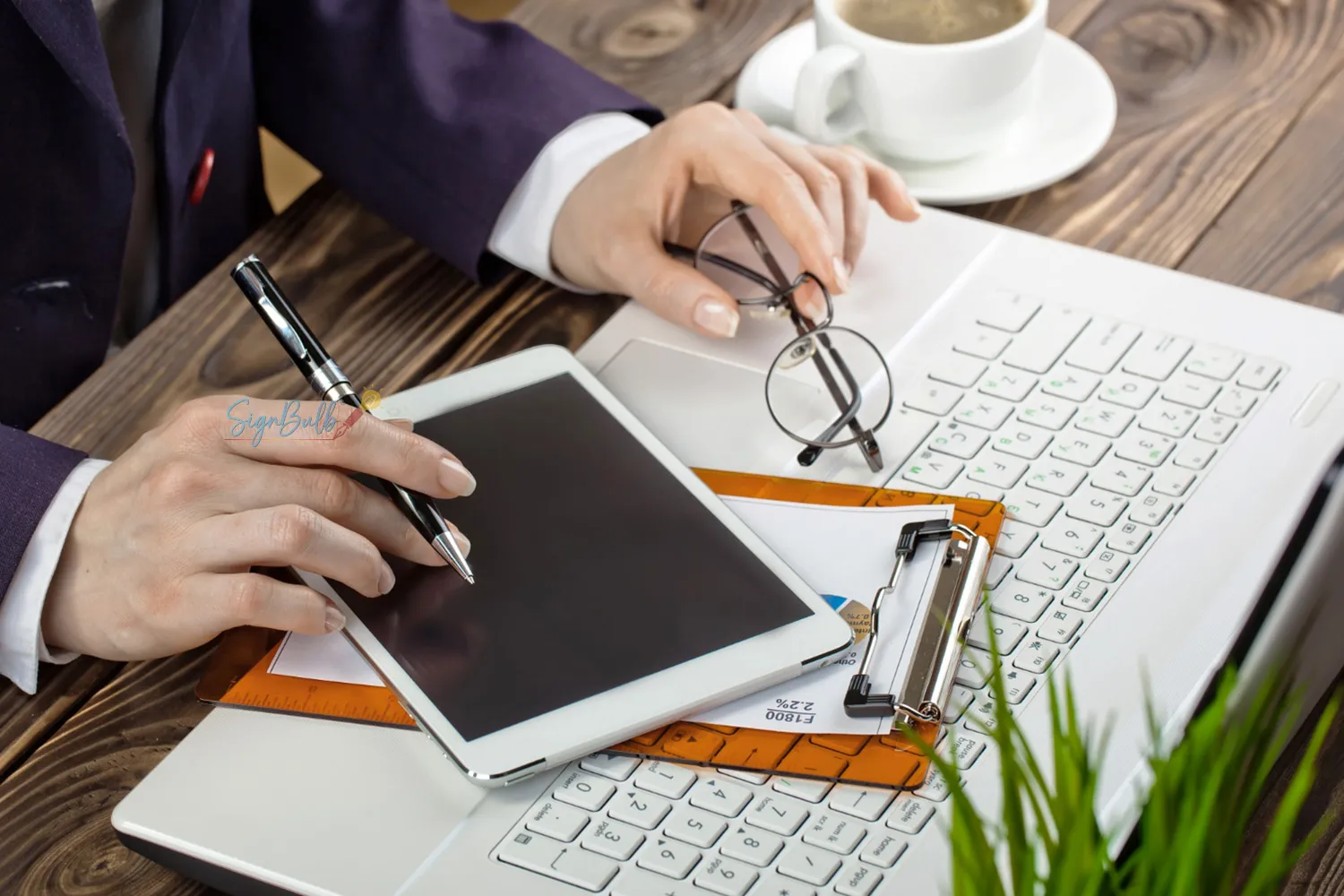 Small business owner signing contracts online on a digital device using a secure electronic signature tool and e signature app.
