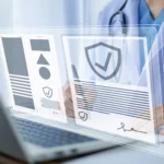 Doctor using laptop for HIPAA compliant eSignature software and secure document signing for multi-location hospitals.