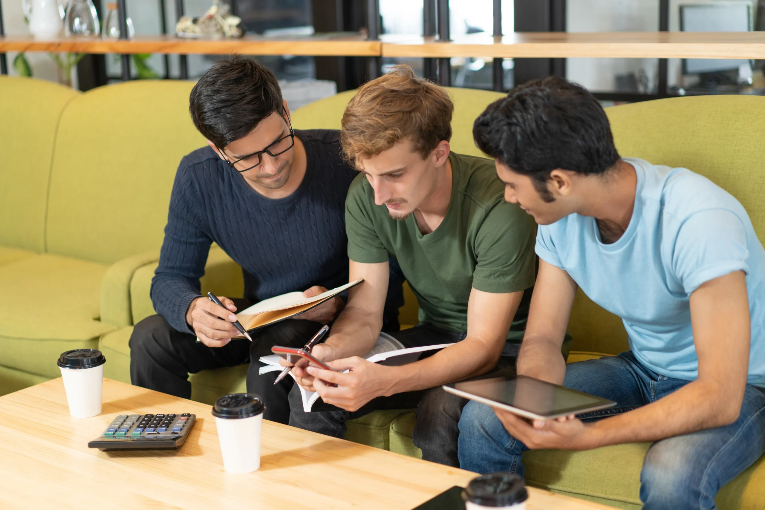 Students using smartphone to earn online with SignBulb affiliate program.