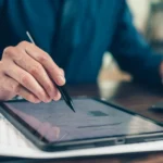 Signing a document on a tablet with a stylus, showing how e-signature software like SignBulb makes digital signatures quick and secure.