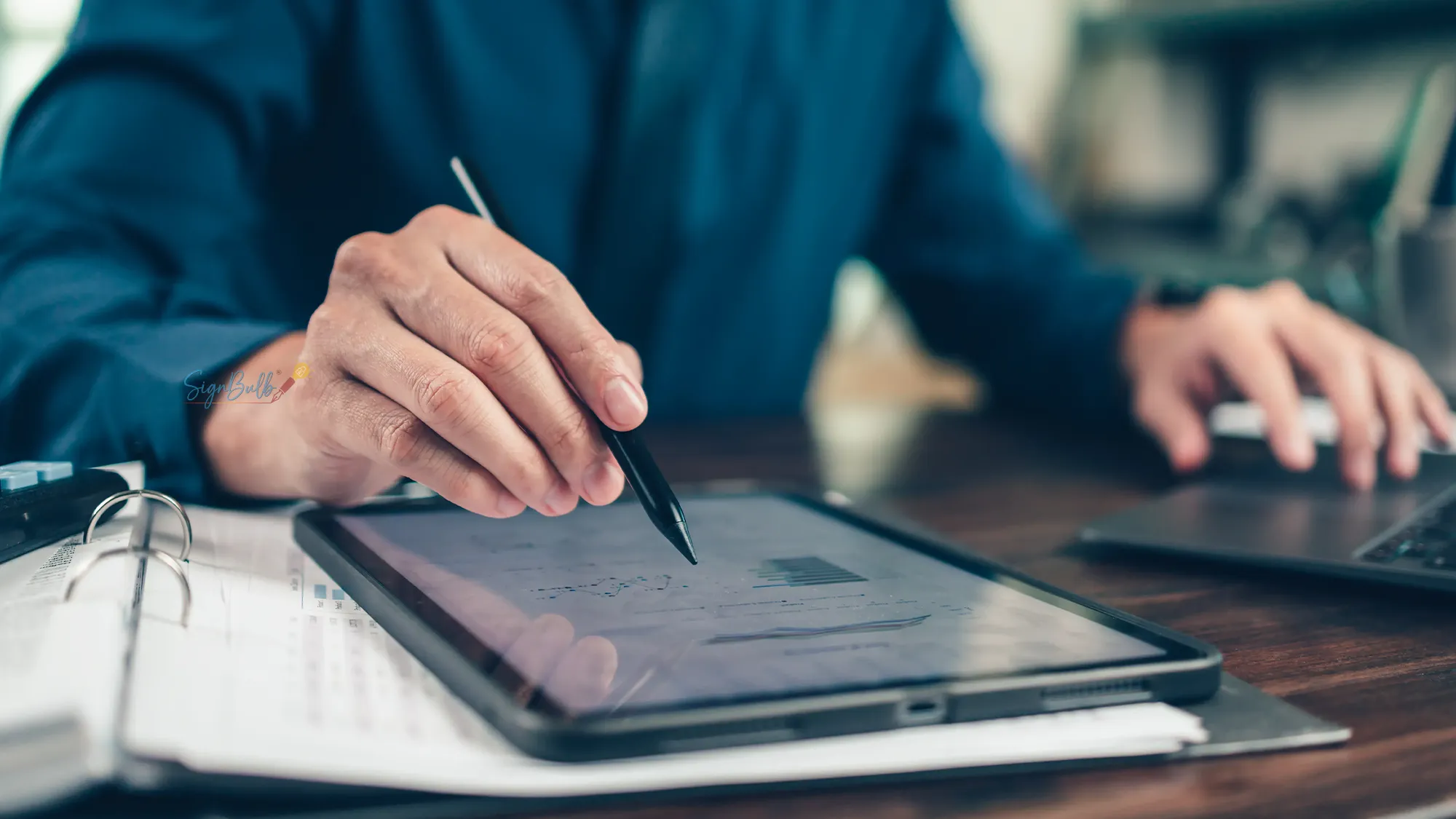 Signing a document on a tablet with a stylus, showing how e-signature software like SignBulb makes digital signatures quick and secure.