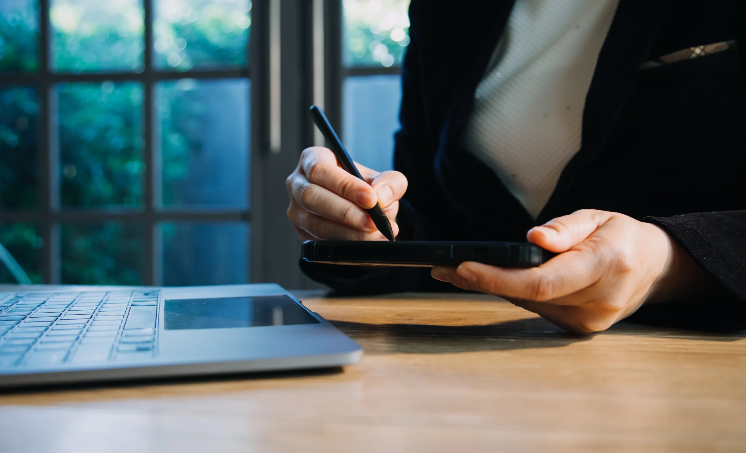 Professional using pen tablet with eSignature app workflow automation and document signing software for companies.