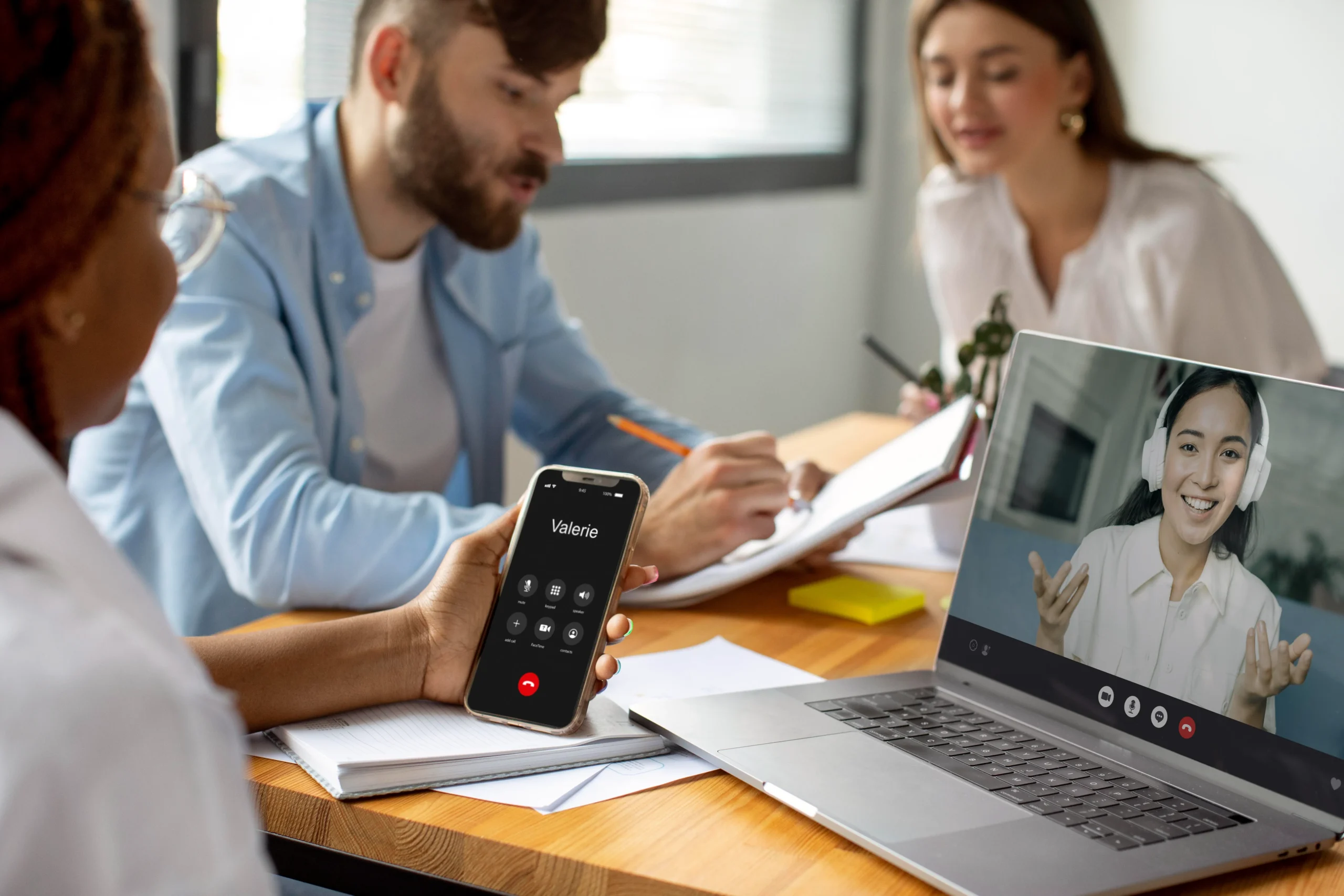 Hybrid meeting with video call, using an e signature app for business to sign documents online securely.