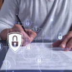 Person signing a document overlaid with digital lock icons, illustrating eSignature security and electronic signature compliance.