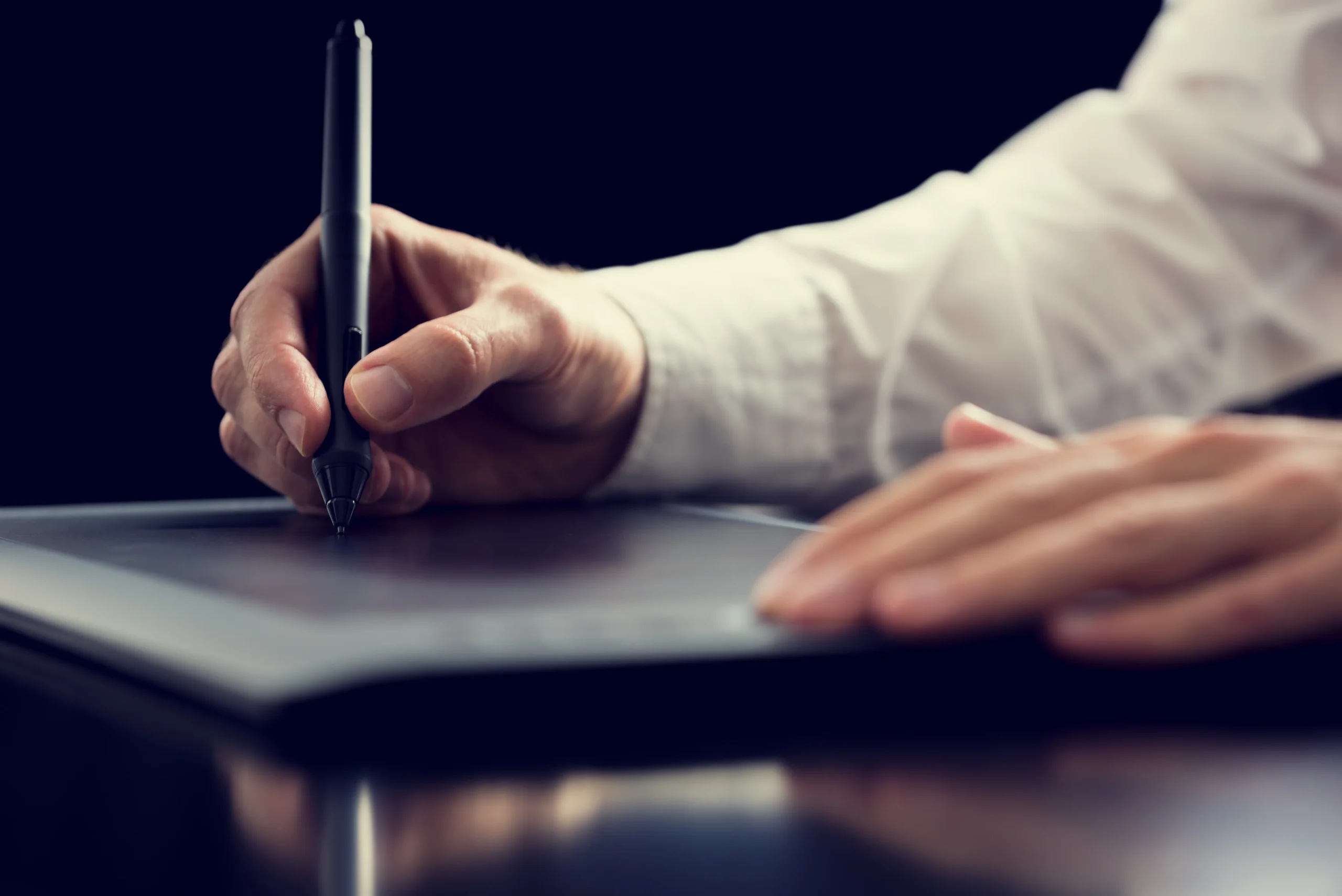 A patient fills out patient consent forms digitally on a tablet, showcasing safe healthcare workflow automation in a medical office.