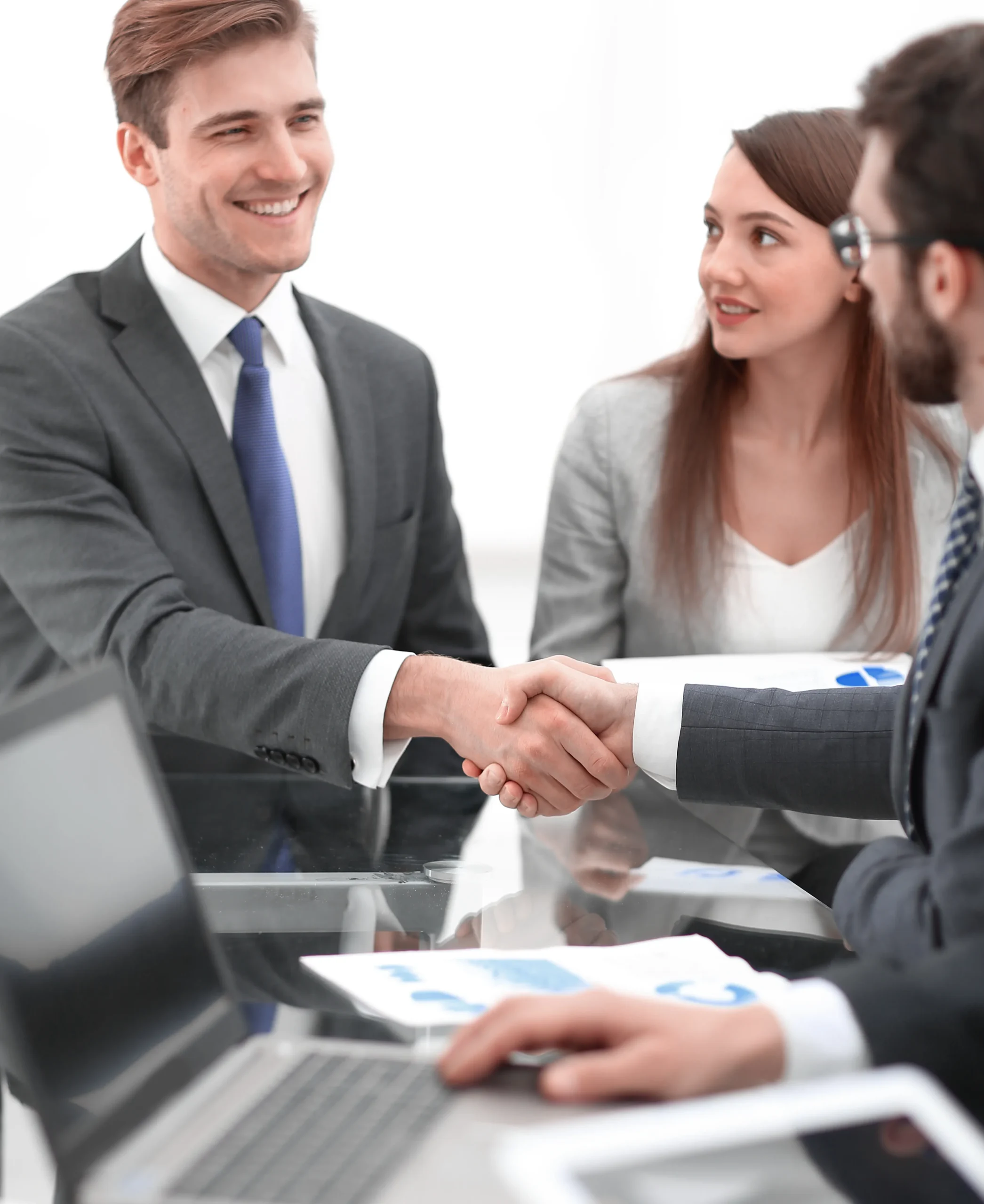 Clients shaking hands with an agent after successfully finalizing a lease agreement eSignature using secure esignature tools.