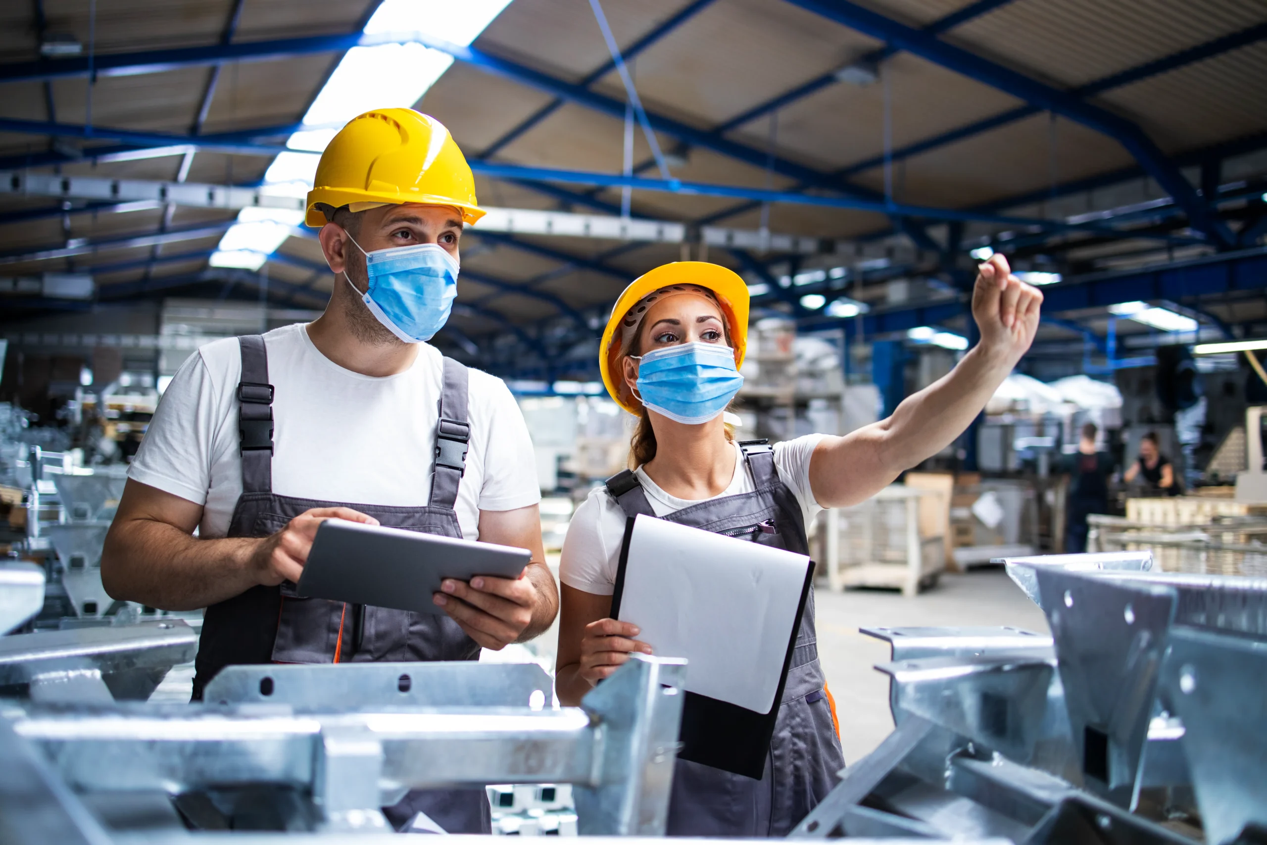 Plant managers using a signature app and document signing app for eSignature for manufacturing.