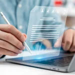 A close-up of a user using a silver stylus over a laptop keyboard to complete a secure digital signature on a glowing virtual contract icon, demonstrating the integration of the Best eSignature API for businesses.
