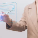 A professional in a beige suit using a stylus pen to write on a glowing digital interface, demonstrating the seamless workflow of modern e signature tools.
