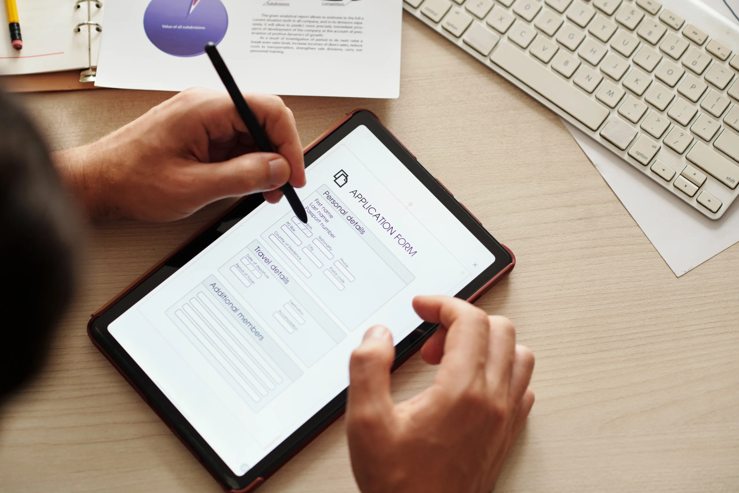 A new recruit filling out a digital application form on a tablet for eSignature HR onboarding.