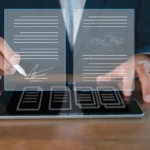 Business executive using a stylus to sign virtual contracts evaluating eSignature software cost.