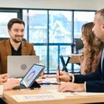 Business team discussing procurement documents using a secure eSignature platform on a tablet.