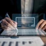 Business executive using a digital pen to sign contracts via eSignature workflow software.