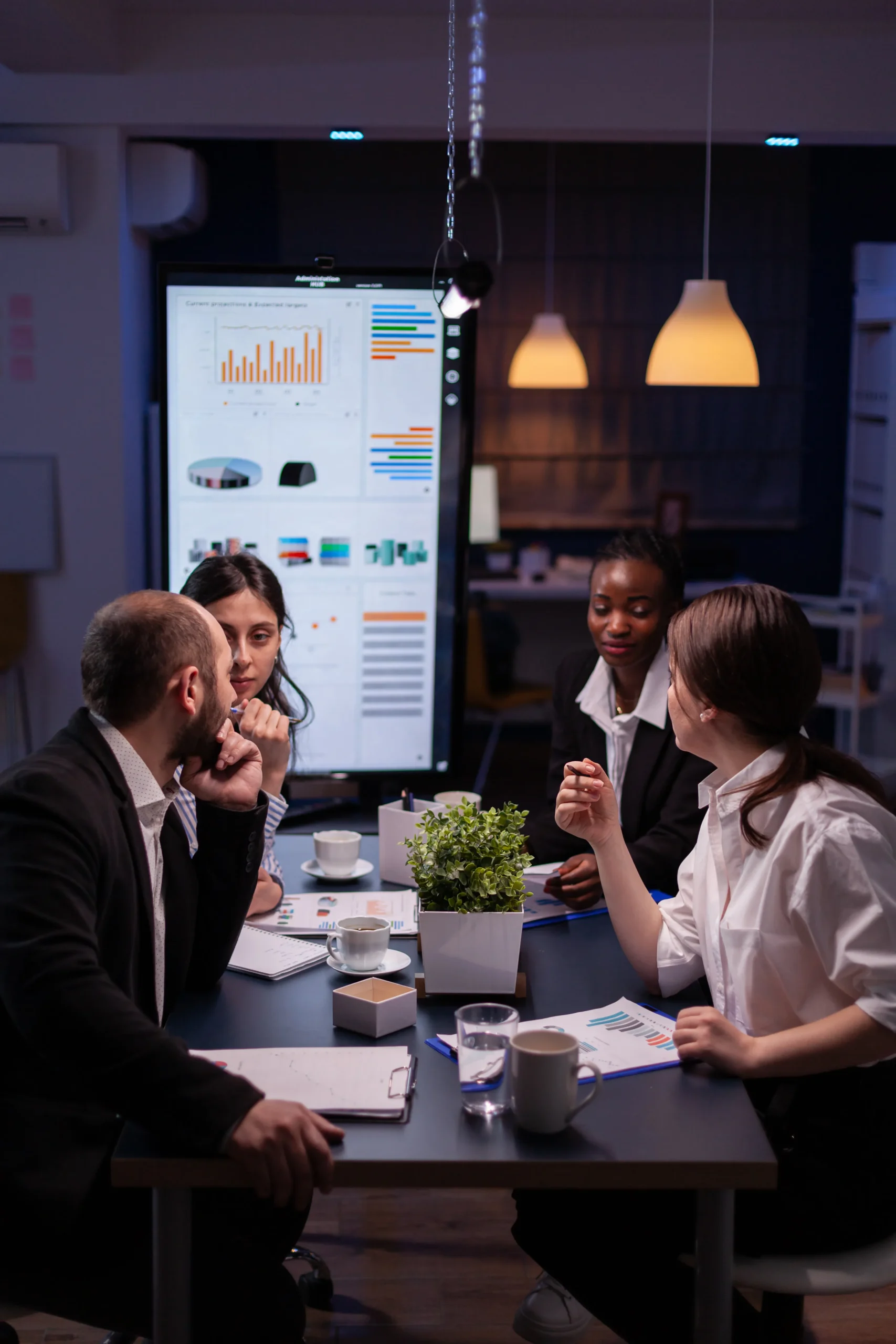 Business team discussing workflow automation and document signing workflows powered by a digital signature API.